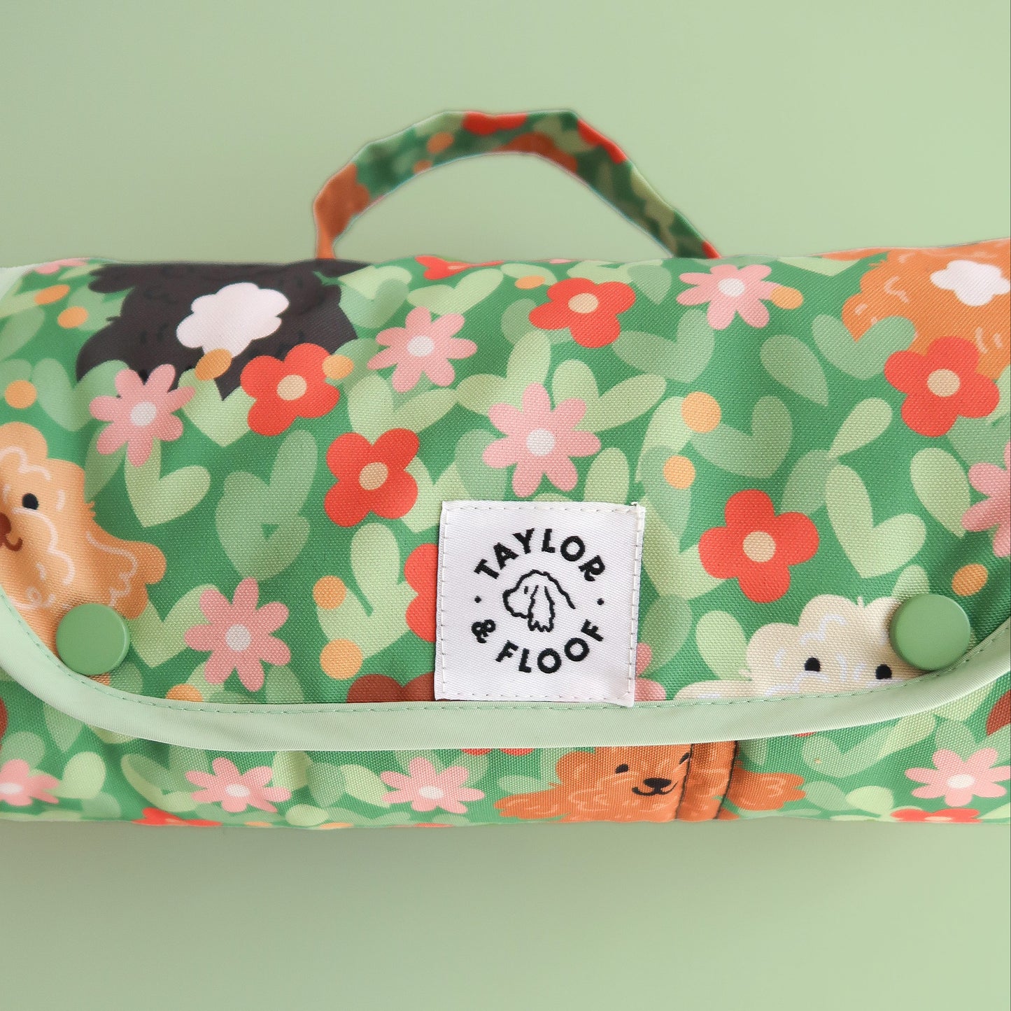 Foldable and roll-up settle mat for dogs with cockapoo pattern. Easy to carry for walks, training sessions, or dog-friendly cafes