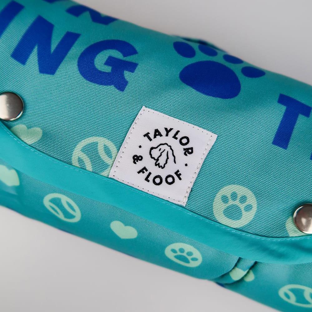 Assistance dog training settle mat, featuring Taylor and Floof’s bold Dog in Training print and a non-slip base. Easy Popper closures and easy to clean material.