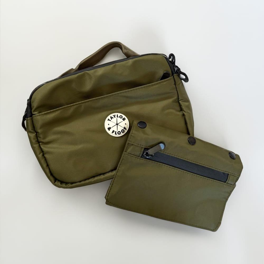 Dog treat bag with removable pouch for training. Compact dog treat pouch small enough for training sessions, available in black and green.