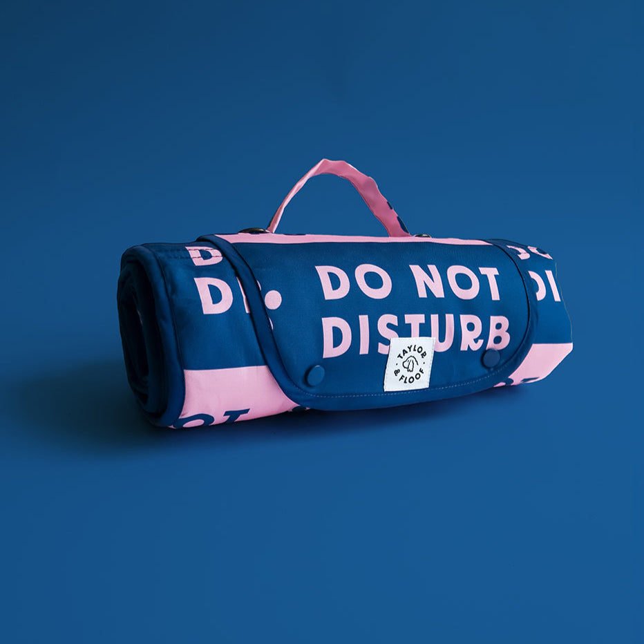 Do Not Disturb 2.0 settle mat for dogs, featuring bold pink and blue design, perfect for calm outings and indoor training.