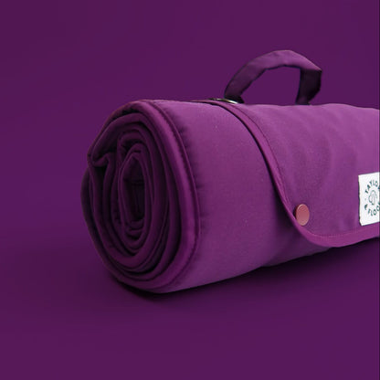 Plum settle mat rolled up focused on the binding 