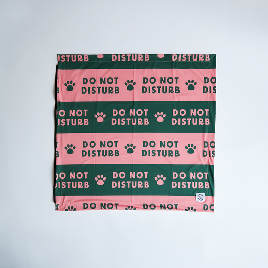 Do Not Disturb dog cooling mat laid flat, pink and green design by Taylor and Floof. Pitta pocket compatible with a zip down the side. Pitta pocket is not included. UK dog summer cooling mat with non-gel fill, perfect for travel and outdoor use