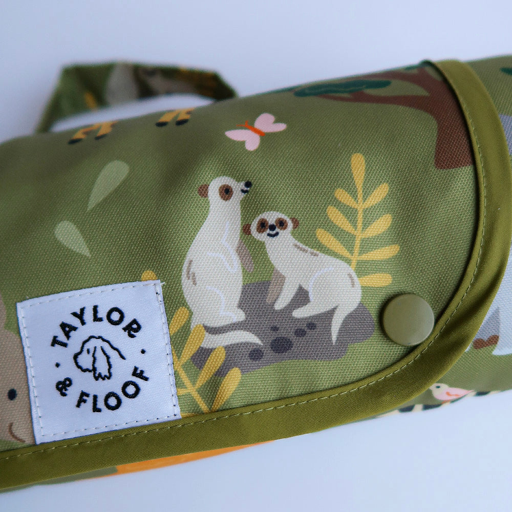 Foldable and portable dog mat with safari animal illustrations, perfect for training and travel. Hero shot of the settle mat with meerkats. 