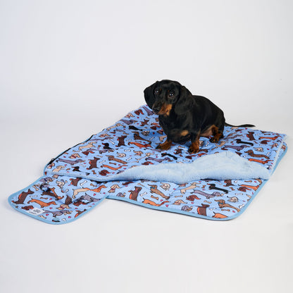 Dachshund lying on settle mat showing size and fit for small dogs