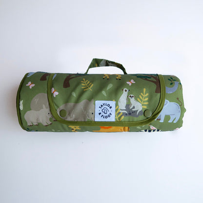 Safari-themed waterproof settle mat for dogs with elephant, giraffe, lion, rhino, and meerkat illustrations.