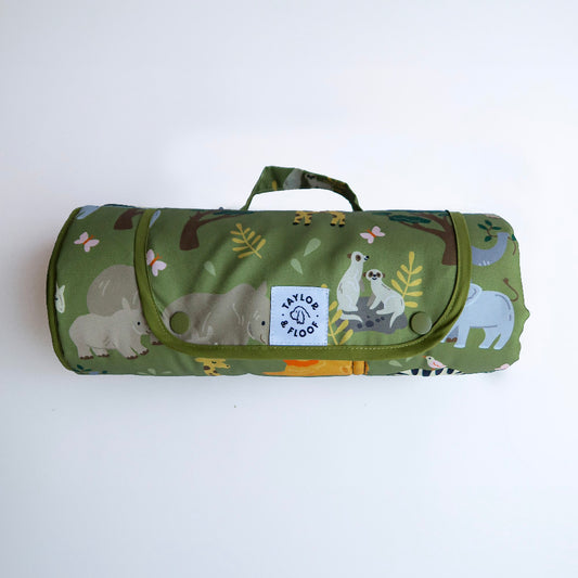 Safari-themed waterproof settle mat for dogs with elephant, giraffe, lion, rhino, and meerkat illustrations.
