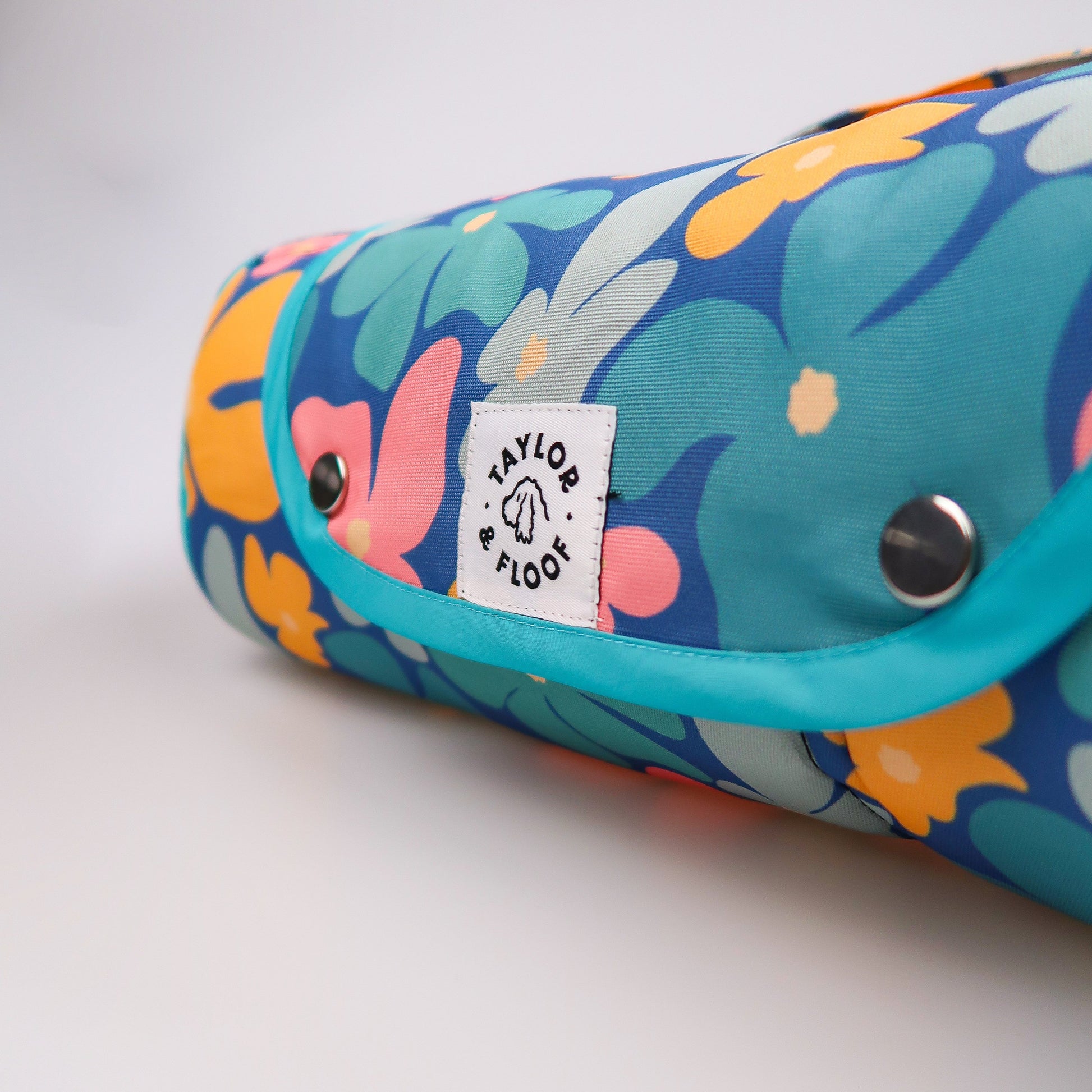 Blooming Wild dog training mat rolled up for easy portability, perfect as a travel mat for dog owners on the go.